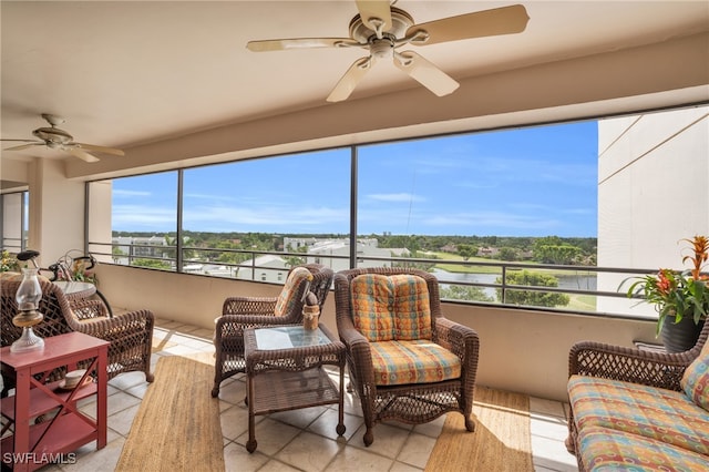 sunroom featuring ceiling fan