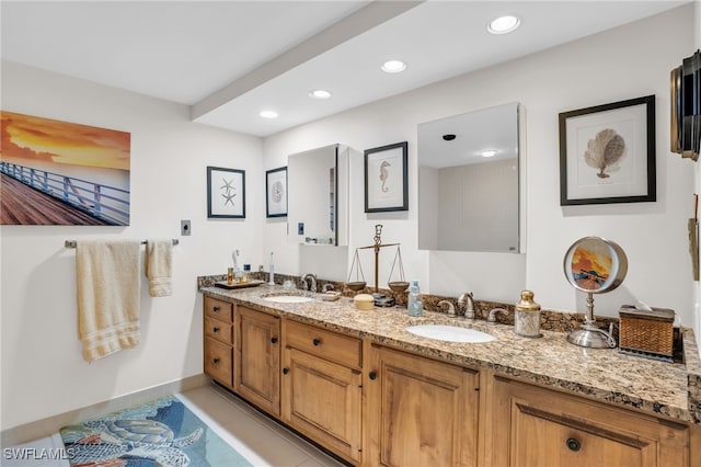 bathroom featuring tile patterned floors and vanity