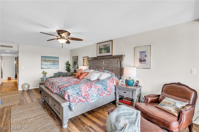 bedroom featuring ceiling fan and dark hardwood / wood-style floors