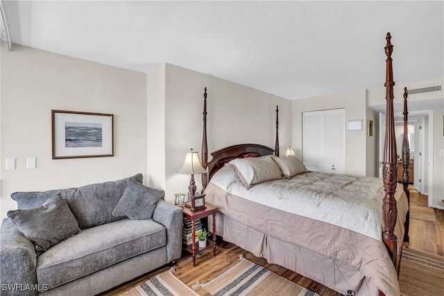 bedroom featuring a closet and wood-type flooring