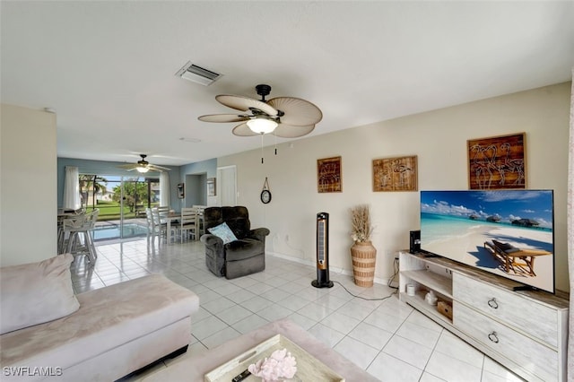 tiled living room with ceiling fan