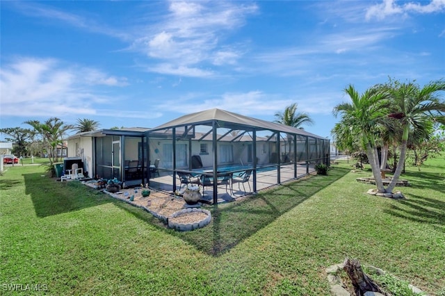 view of swimming pool with a lanai, a yard, and a patio area