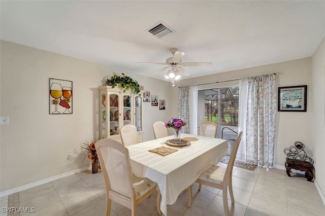 dining space featuring ceiling fan and light tile patterned floors