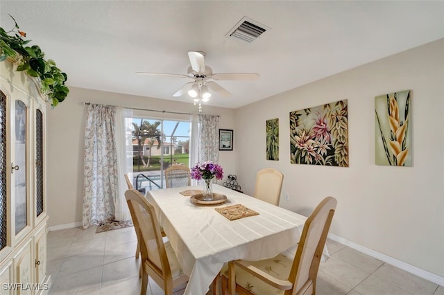 tiled dining room with ceiling fan