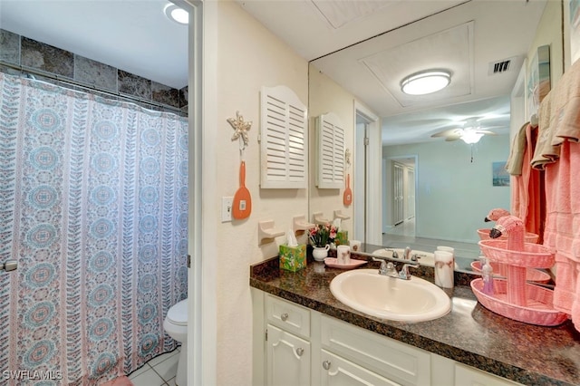 bathroom with tile patterned floors, vanity, and toilet