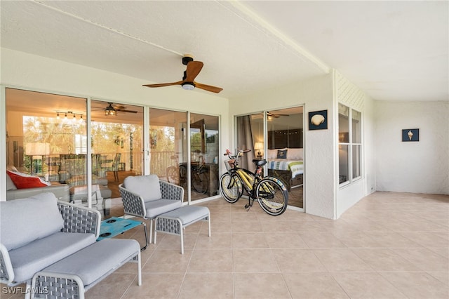 sunroom with a ceiling fan