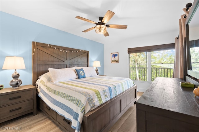 bedroom featuring light wood-style flooring and a ceiling fan