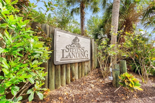 community sign with fence