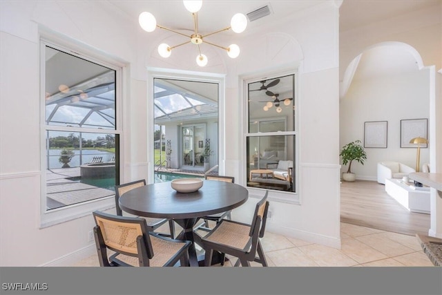 dining room featuring an inviting chandelier and light wood-type flooring