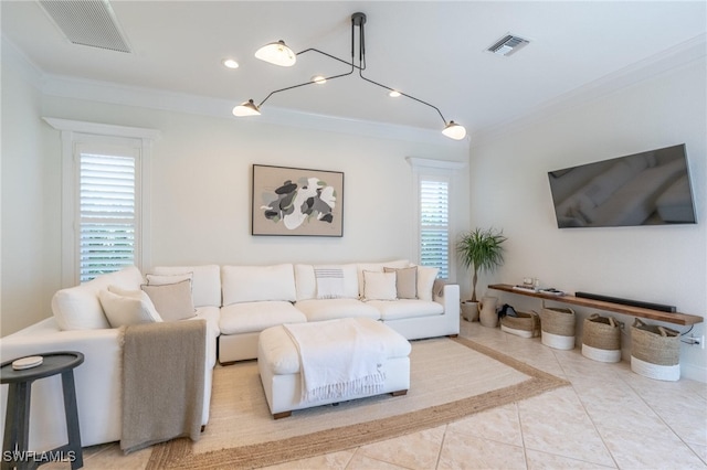 living room with light tile patterned floors and ornamental molding