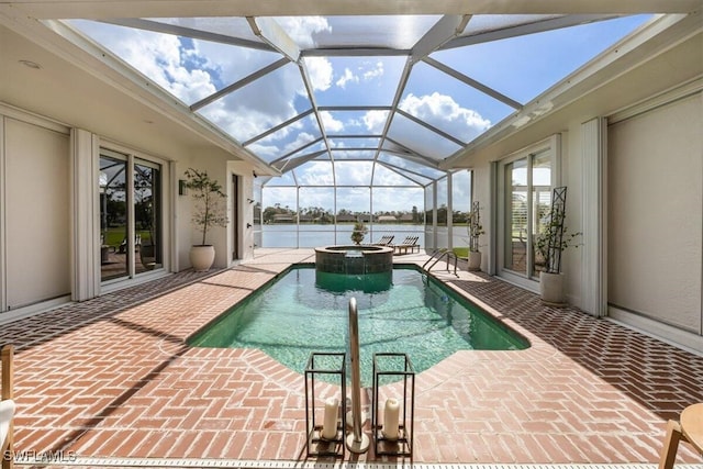 view of swimming pool featuring a patio, glass enclosure, and an in ground hot tub