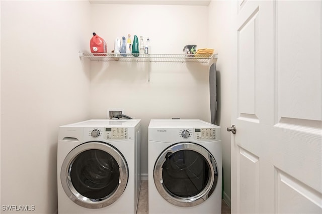 washroom featuring washing machine and dryer