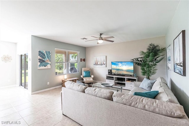 tiled living room with ceiling fan