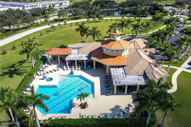 birds eye view of property with a water view