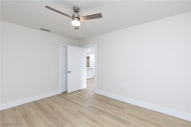 spare room featuring ceiling fan and light hardwood / wood-style floors