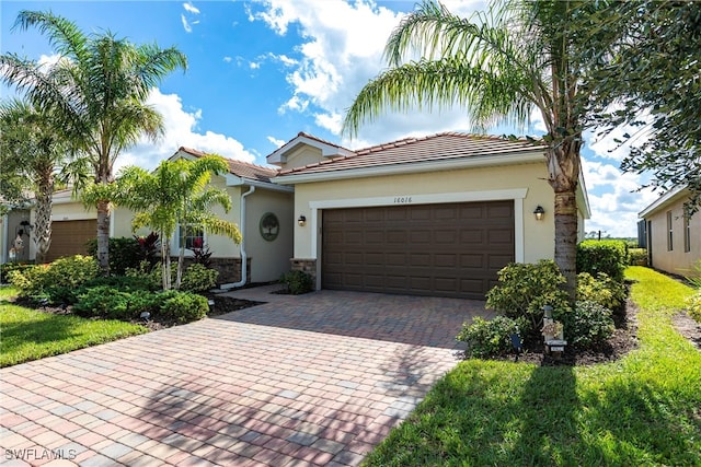 mediterranean / spanish house with a garage