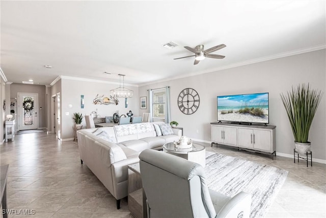 living room with baseboards, visible vents, and crown molding