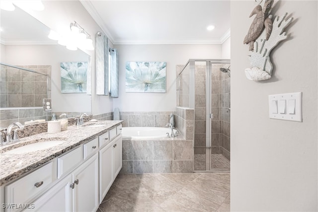 full bath with a garden tub, ornamental molding, and a sink