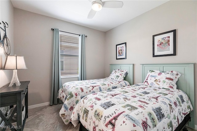 bedroom featuring ceiling fan and baseboards