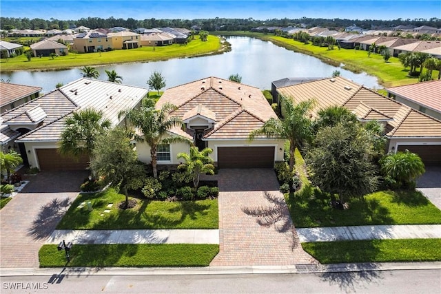 birds eye view of property with a water view