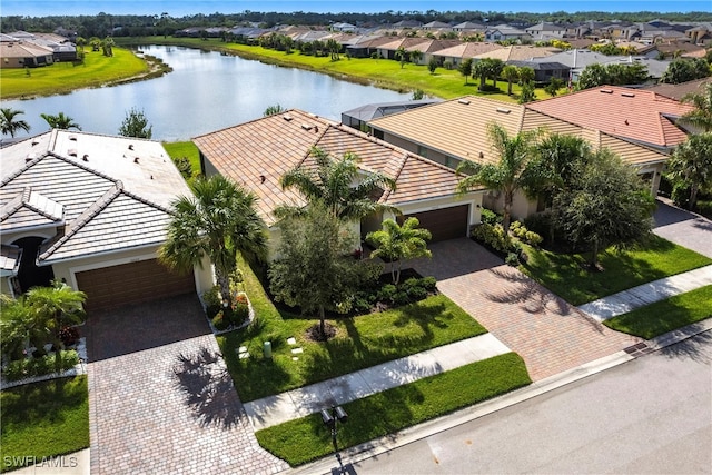 aerial view with a water view and a residential view