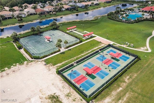 drone / aerial view featuring a water view and a residential view