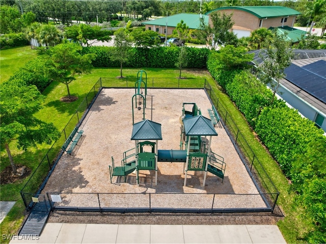 surrounding community with a yard and a playground