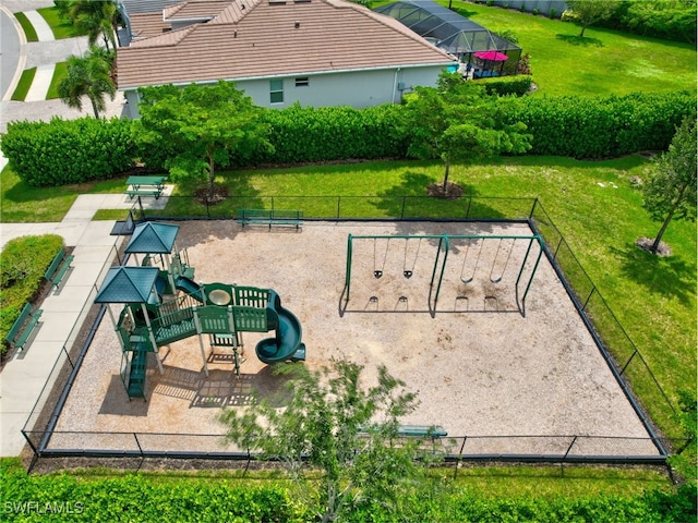 view of home's community featuring a yard and a playground