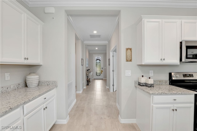 kitchen with white cabinets and appliances with stainless steel finishes