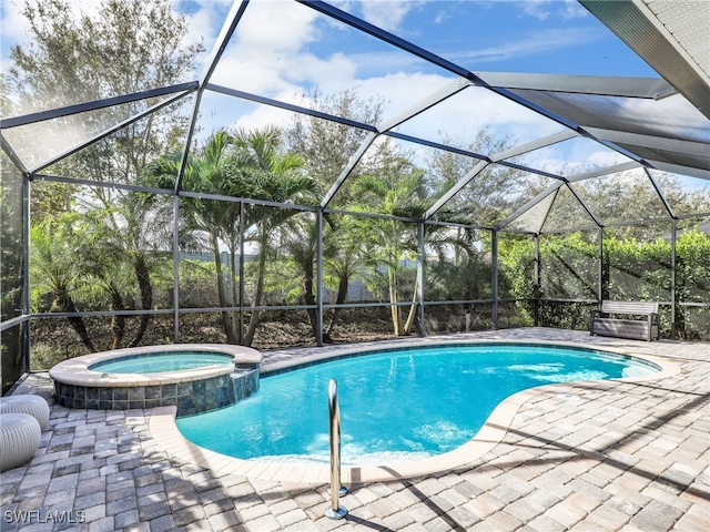 view of swimming pool featuring a lanai, an in ground hot tub, and a patio