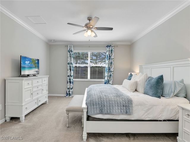 carpeted bedroom featuring ceiling fan and ornamental molding