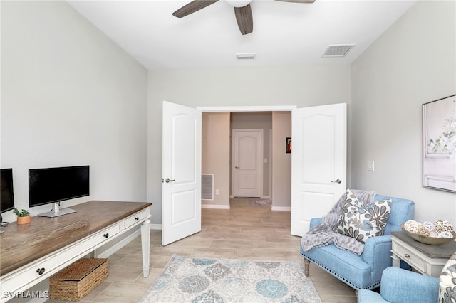 home office featuring ceiling fan and light wood-type flooring