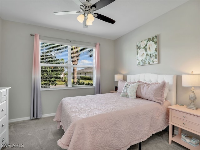 bedroom featuring light carpet and ceiling fan