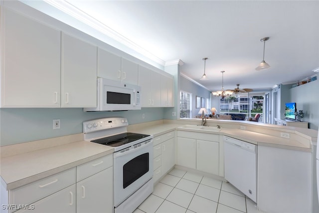 kitchen with white appliances, crown molding, kitchen peninsula, hanging light fixtures, and white cabinetry