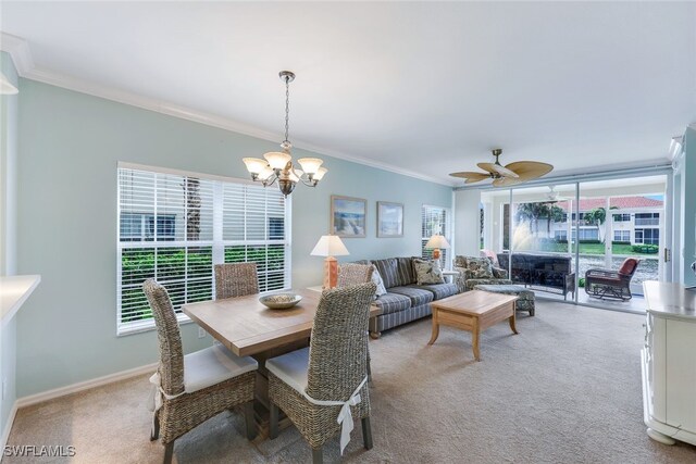 23711 Old Port Rd Unit 101, Estero, FL 34135 - dining area featuring light colored carpet, a chandelier, ornamental molding, ceiling fan, and baseboards
