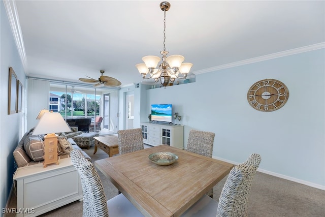 dining space featuring carpet, ceiling fan with notable chandelier, and ornamental molding