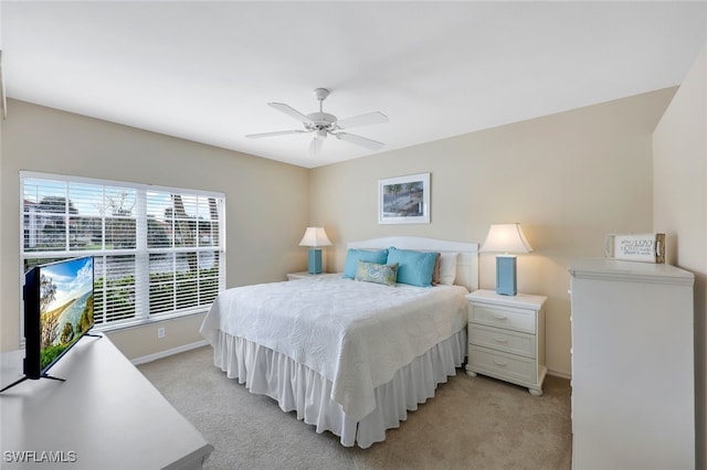 23711 Old Port Rd Unit 101, Estero, FL 34135 - bedroom featuring light carpet, baseboards, and ceiling fan