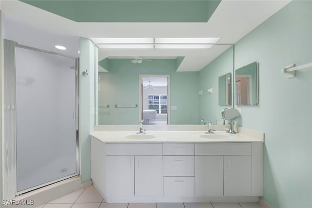 bathroom featuring tile patterned flooring, vanity, a shower with door, and ceiling fan