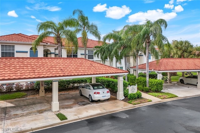 view of parking / parking lot with a carport