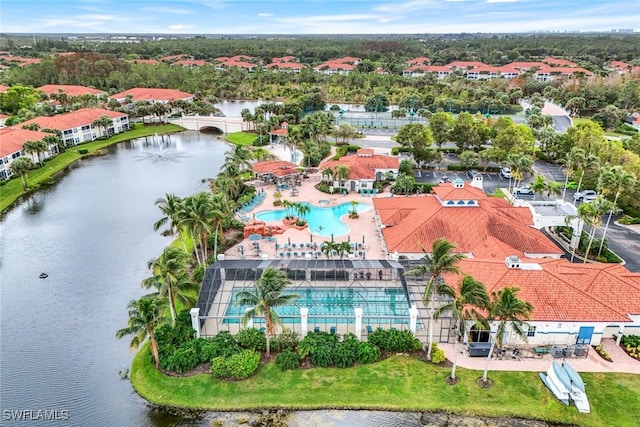 birds eye view of property with a water view