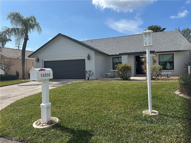 ranch-style home with a garage and a front lawn