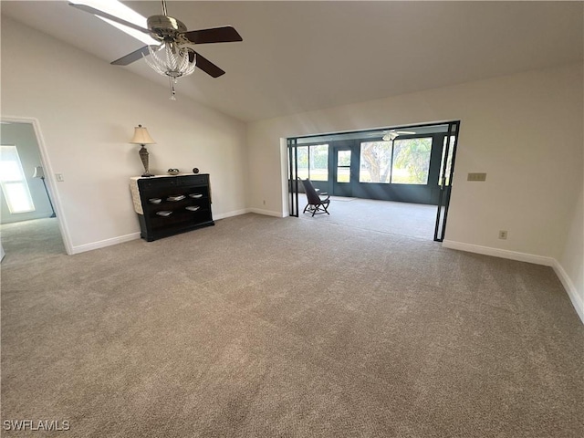 unfurnished living room featuring ceiling fan, carpet flooring, and high vaulted ceiling