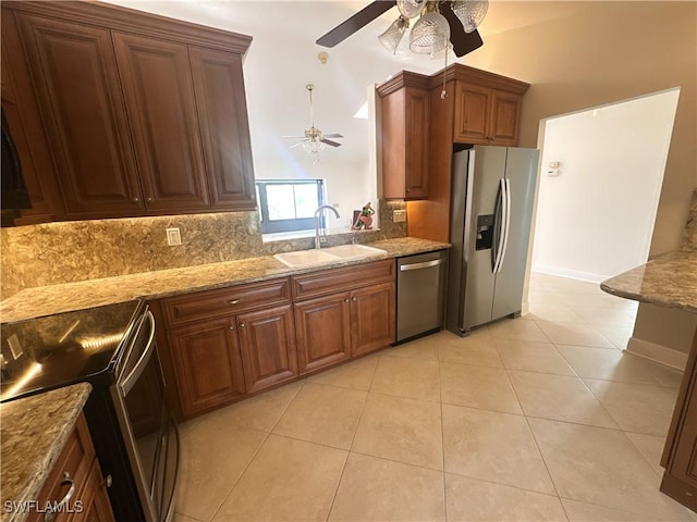 kitchen with appliances with stainless steel finishes, sink, backsplash, light tile patterned floors, and ceiling fan