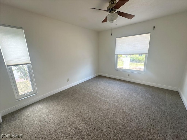 carpeted empty room with ceiling fan