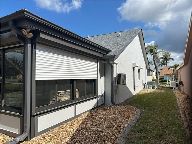 view of home's exterior with ac unit, central AC, and a lawn