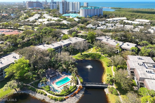 birds eye view of property with a water view