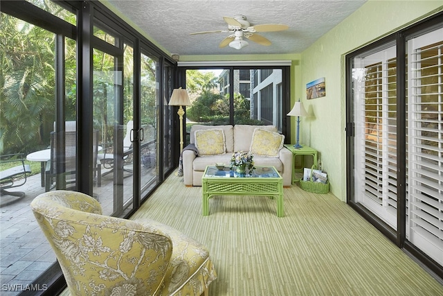 sunroom / solarium with ceiling fan