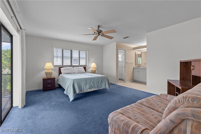 bedroom featuring ceiling fan, light colored carpet, access to outside, and connected bathroom