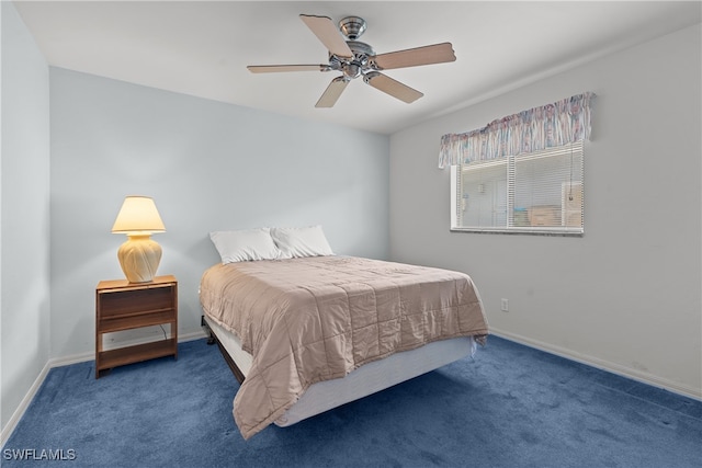 bedroom with ceiling fan and dark colored carpet