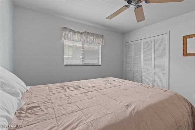 bedroom with ceiling fan and a closet